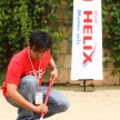 Grand Prize winner Tan Boon Seong searching for coins in the sandpit