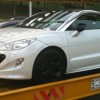 White Peugeot RCZ snapped on trailer in Putrajaya