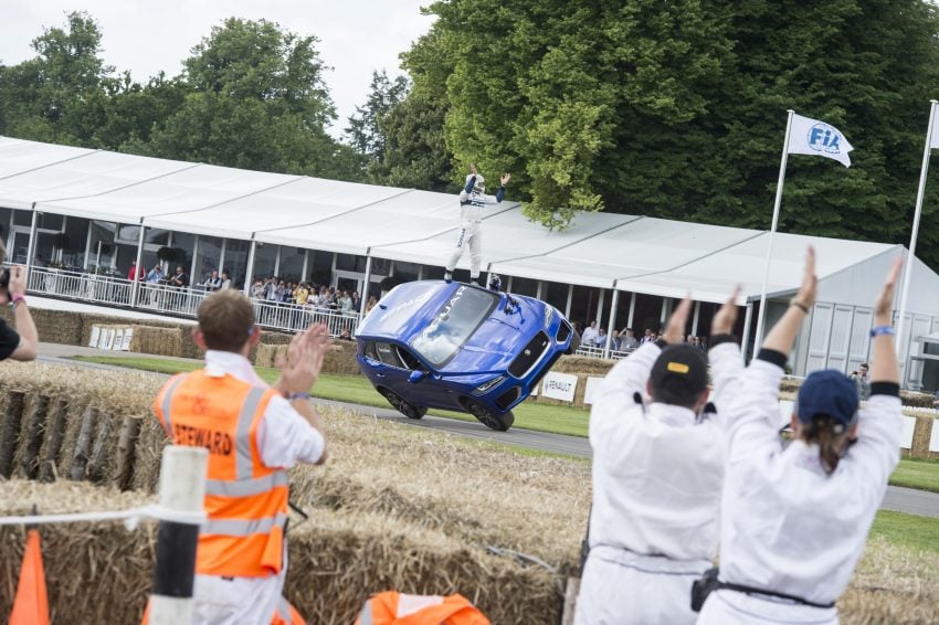 Jaguar F-Pace rides up Goodwood Hill on two wheels 513248