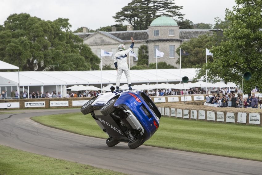 Jaguar F-Pace rides up Goodwood Hill on two wheels 513250