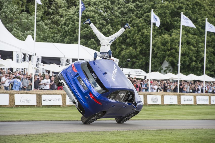 Jaguar F-Pace rides up Goodwood Hill on two wheels 513216