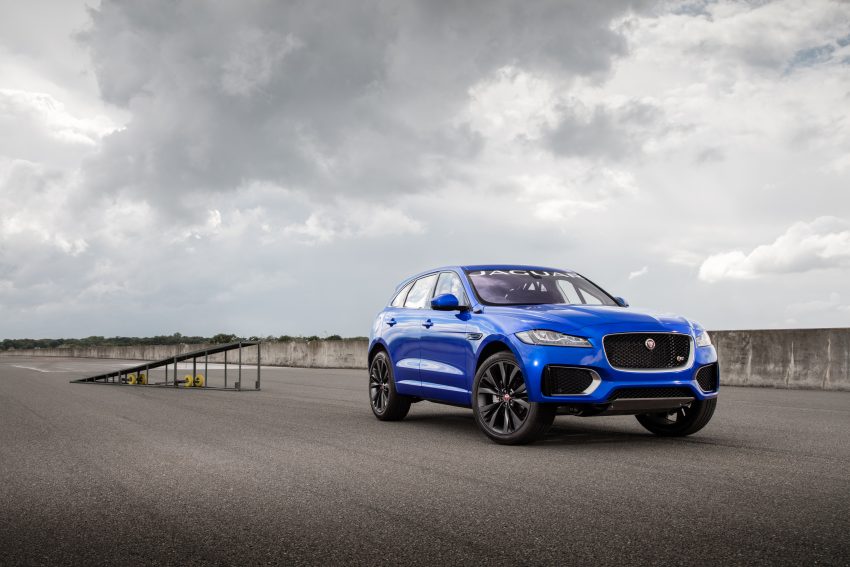 Jaguar F-Pace rides up Goodwood Hill on two wheels 513262