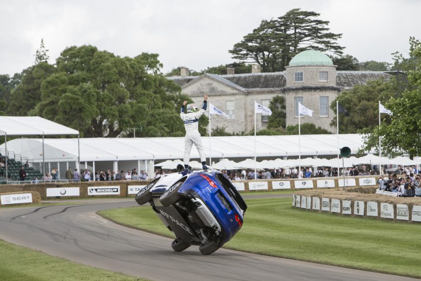Jaguar F-Pace rides up Goodwood Hill on two wheels 513218