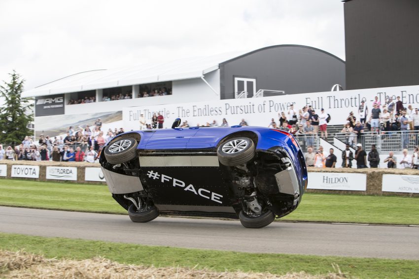 Jaguar F-Pace rides up Goodwood Hill on two wheels 513226