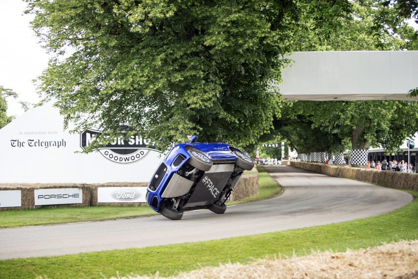 Jaguar F-Pace rides up Goodwood Hill on two wheels 513235