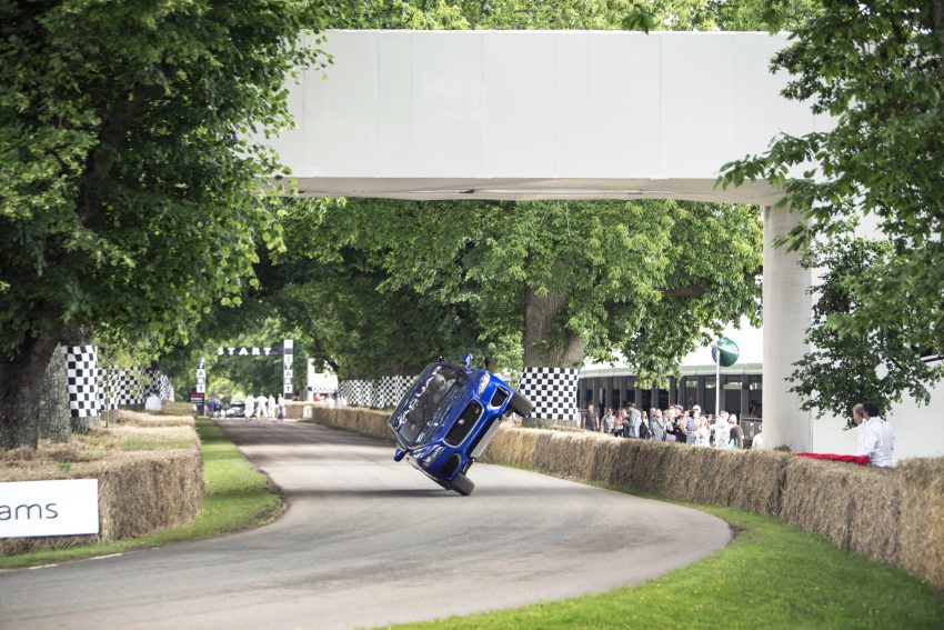 Jaguar F-Pace rides up Goodwood Hill on two wheels 513240
