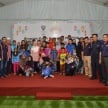 Proton taja pakaian raya untuk balu, anak-anak yatim bekas kakitangannya dalam program Kasih Ramadan