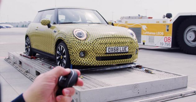 MINI Cooper SE gets teased towing a Boeing 777F