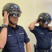 KTM equips auxiliary police with temperature scanner helmets to further curb the spread of Covid-19 virus