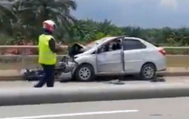 Perodua Bezza goes against traffic on the SKVE after an accident, then hits another motorcycle – video