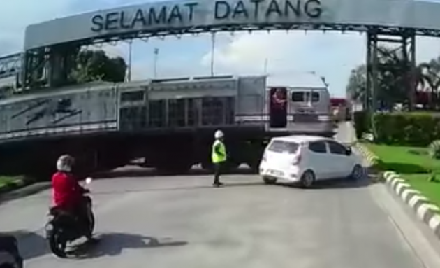 Axia hit by train in Johor, car deemed at fault – PDRM