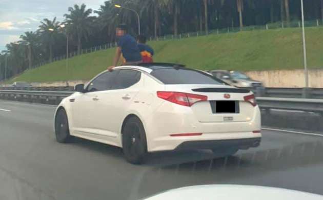 Viral: Man shows off his body out of moving car's sunroof in UP's