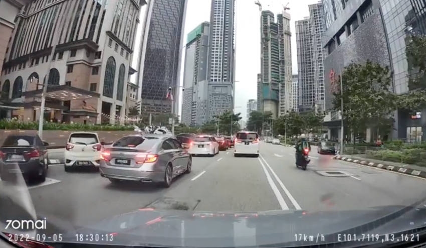 Grab rider speeds through KL traffic jam via opposite lane; crashes into innocent, unsighted Honda Civic 1508141