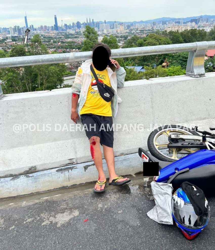 SUKE highway accident caused by Myvi stopping on emergency lane to take in KL view – rider injured 1513168