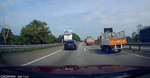 North-South Highway in Malaysia – maintenance trucks stopping on right lane; no cones, no warning!