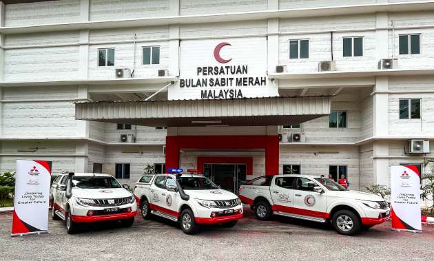 MMM gives three Mitsubishi Triton pick-up trucks to Malaysia Red Crescent Society for flood assistance
