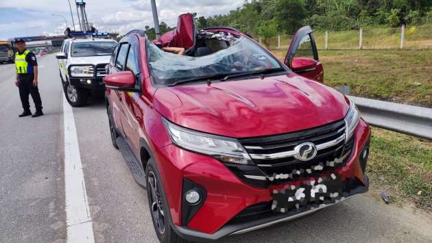 Perodua Aruz hit by loose truck wheel; person injured