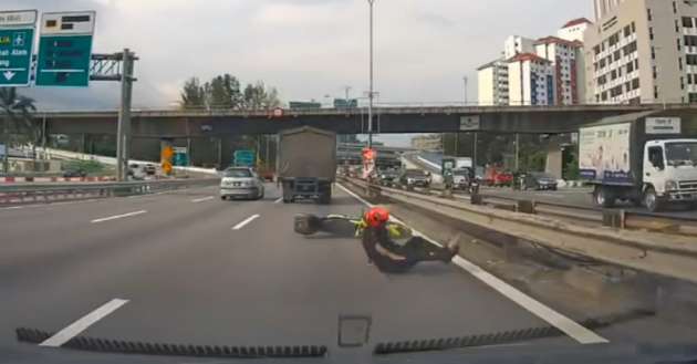 Motorcyclist crashes into lorry on Malaysian highway and is thrown off his bike – be mindful on the road