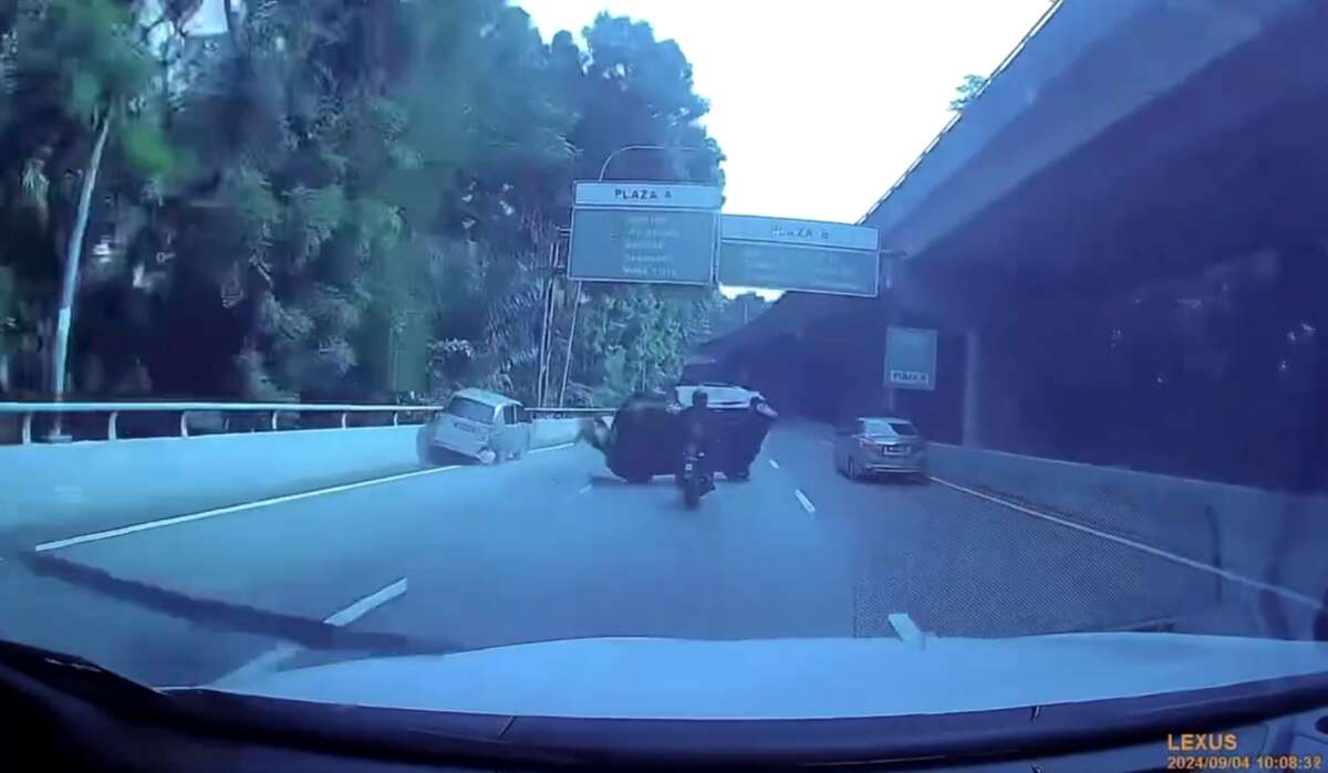 Car smashes into stopped vehicle on Kerinchi Link, bike hits crashed car, rider narrowly escapes death