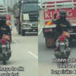 Motorcyclist seen in viral video using a mobile phone to record herself while riding closely behind a lorry