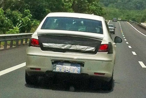 White Peugeot 408 with black tape testing on the NSE