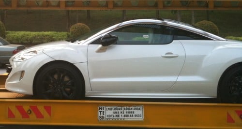 White Peugeot RCZ snapped on trailer in Putrajaya