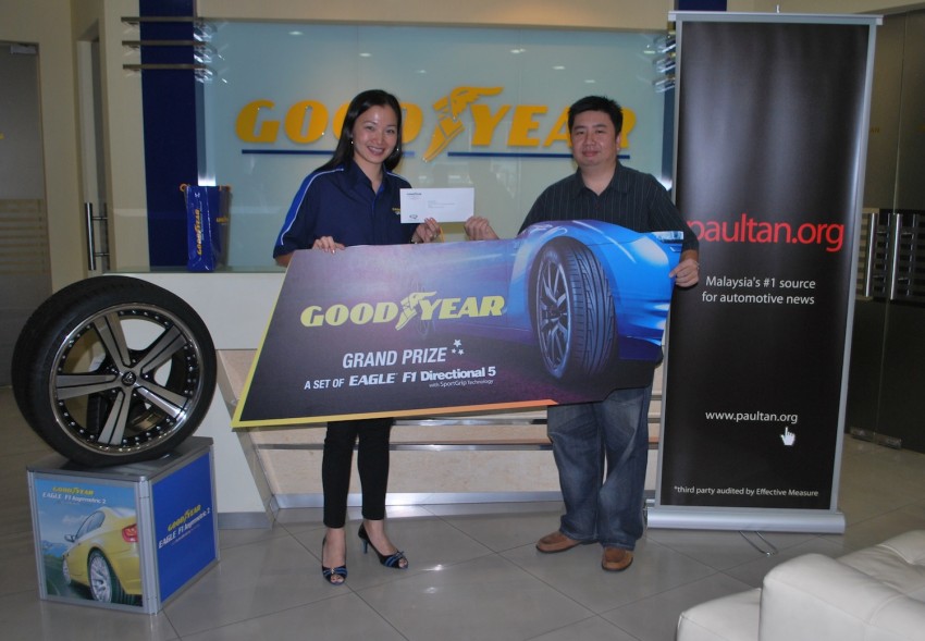 Lucky winners of the Goodyear Get The Grip contest drive home with their prizes! 144318