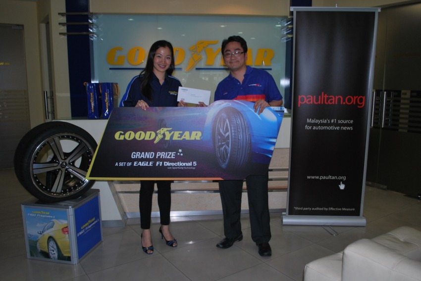 Lucky winners of the Goodyear Get The Grip contest drive home with their prizes! 144316