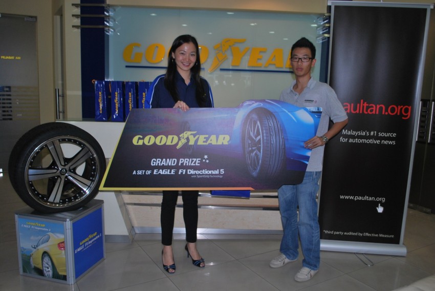 Lucky winners of the Goodyear Get The Grip contest drive home with their prizes! 144315