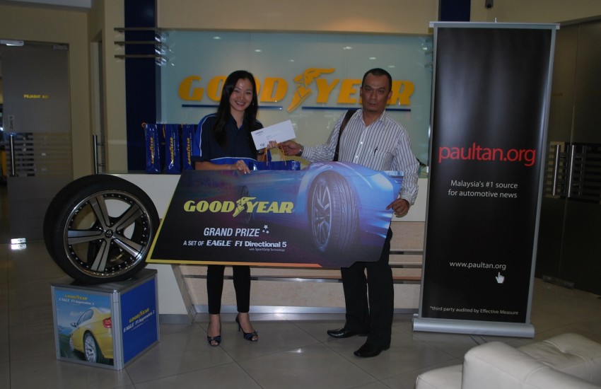 Lucky winners of the Goodyear Get The Grip contest drive home with their prizes! 144320
